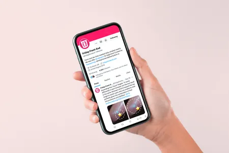 A phone displaying the Friday Front-End twitter feed.